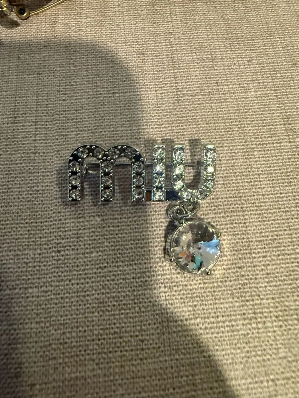 New MIU Crystal Logo Pendant brooch  in Silver  tone no box